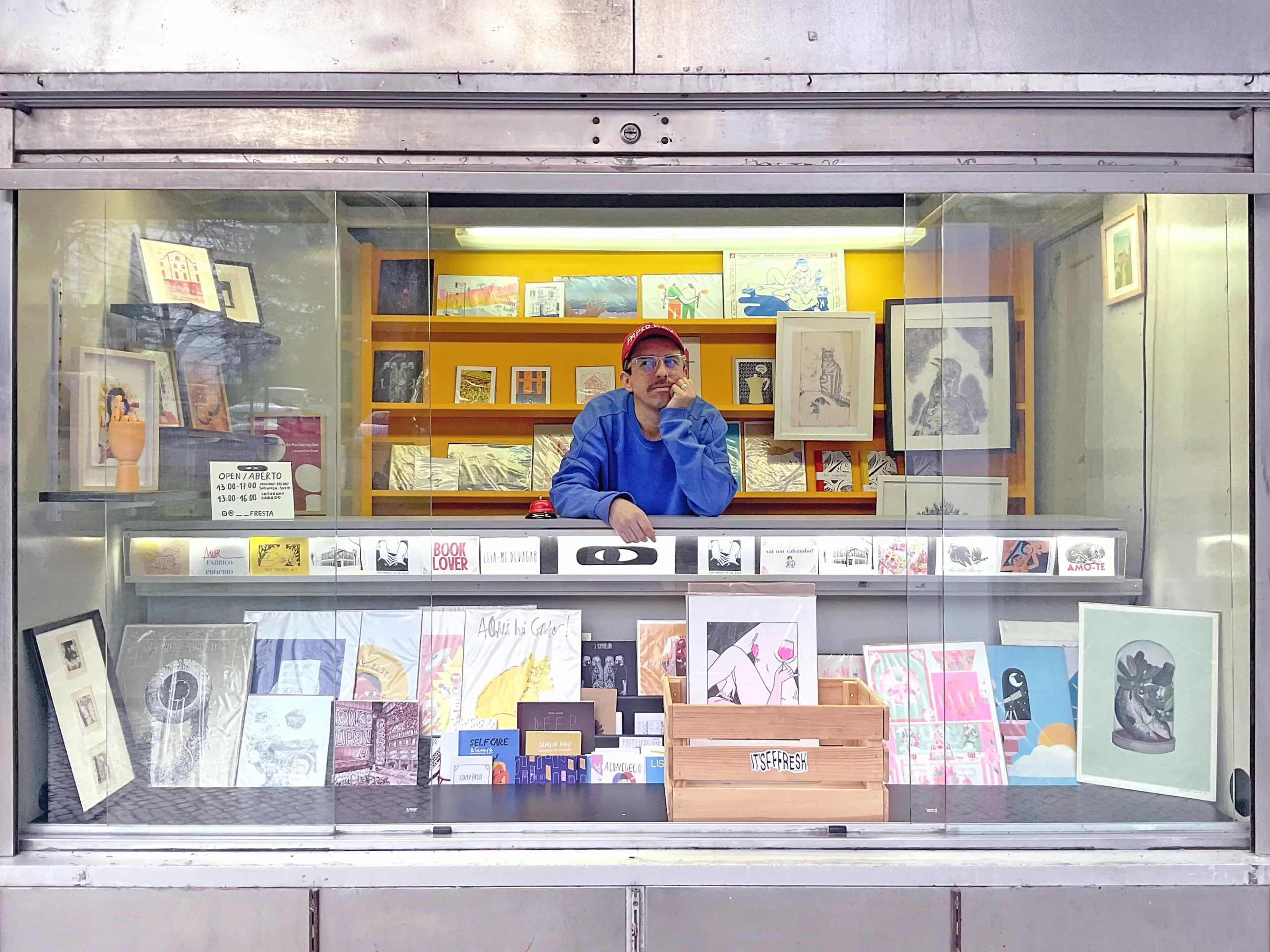 paperboy at newsstand of art and illustration located in Lisbon, Portugal